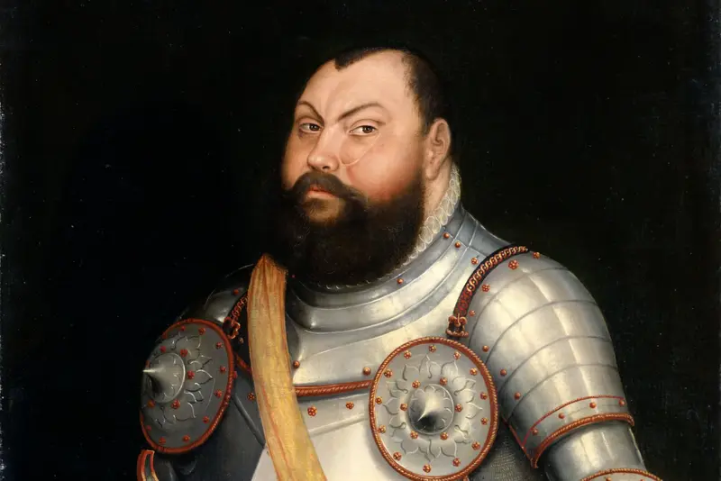 breiter, bärtiger Mann in Rüstung